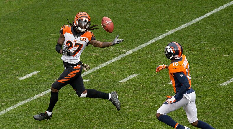 DENVER, CO - NOVEMBER 19: Cornerback Dre Kirkpatrick #27 of the Cincinnati Bengals fumbles the ball after an 87 yard return and is chased down by wide receiver Emmanuel Sanders #10 of the Denver Broncos after intercepting a pass in the first quarter of a game at Sports Authority Field at Mile High on November 19, 2017 in Denver, Colorado. Kirkpatrick recovered the fumble. (Photo by Justin Edmonds/Getty Images)