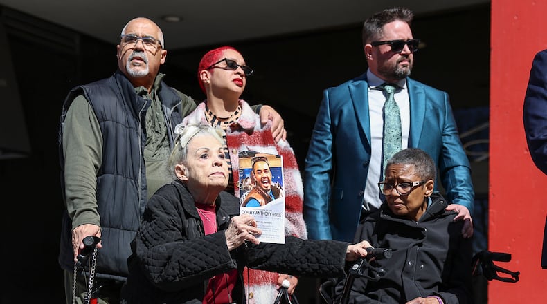 Family members of Colby Ross watch during a press conference on Monday in downtown Dayton. The family of Ross has filed a lawsuit against Montgomery County law enforcement, claiming officers violated policies surrounding chases and acted negligently. BRYANT BILLING / STAFF