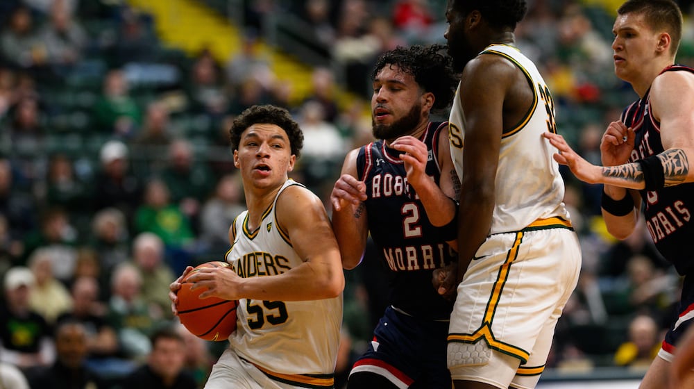 Wright State University freshman Michael Cooper drives past Robert Morris University junior Ryan Prather, Jr. during their game on Sunday, Feb. 22, 2026 at the Nutter Center. The Colonials beat the Raiders 81-68. JEREMY MILLER / CONTRIBUTED PHOTO