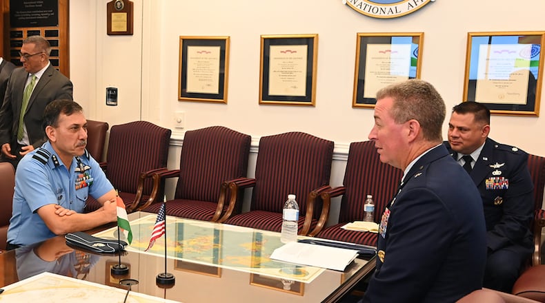 Brig. Gen. Brian Bruckbauer hosts an office call in honor of his fellow co-chair of the U.S.-India Defense Technology and Trade Initiative Air Vice Marshal Narmdeshwar Tiwari in the Pentagon, Arlington, Va., July 16. U.S. AIR FORCE PHOTO/ANDY MORATAYA