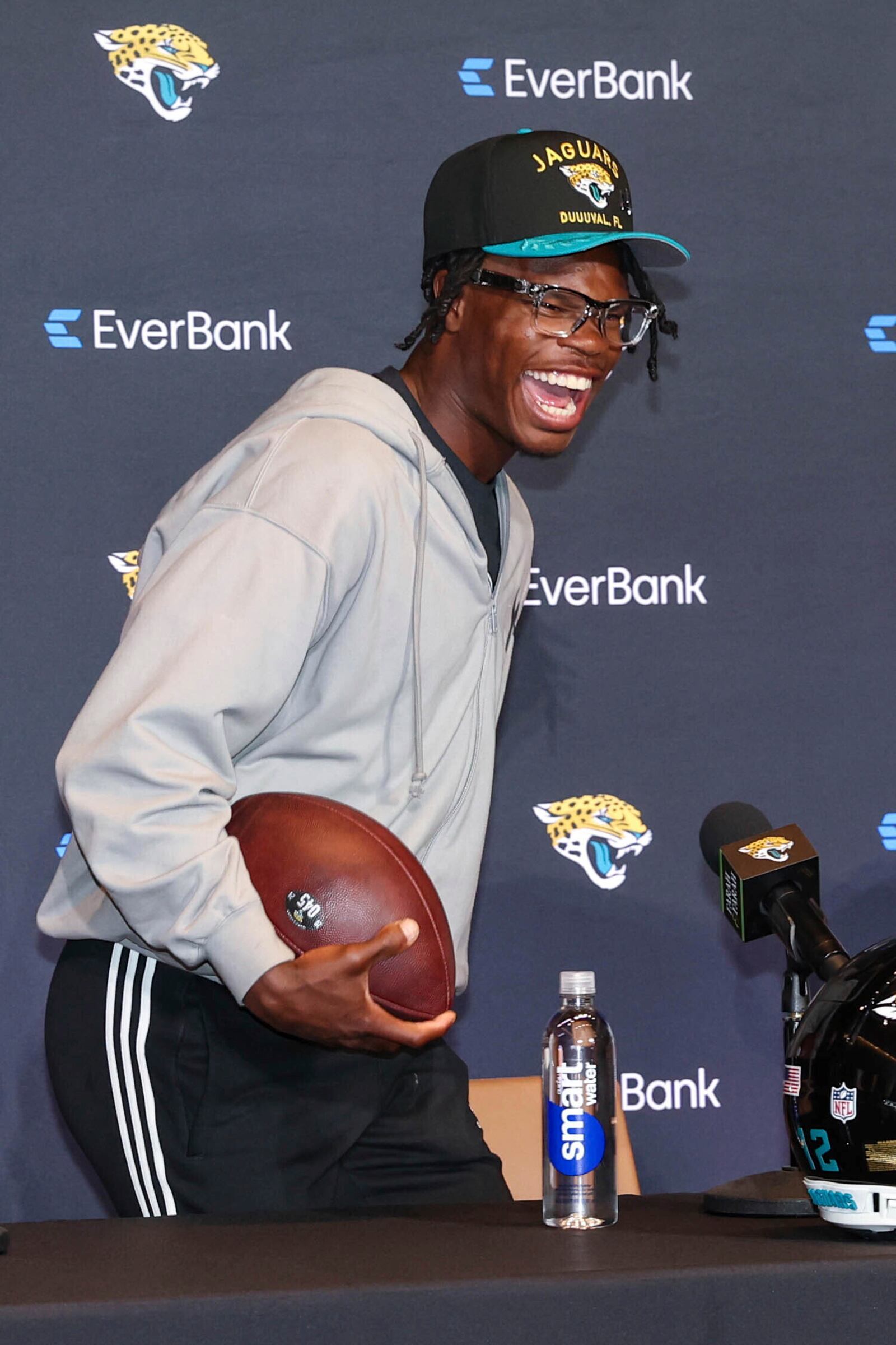 Two-way player Travis Hunter, the Jacksonville Jaguars first round draft pick, second overall, laughs with reporters during an NFL football press conference, Friday, April 25, 2025, in Jacksonville, Fla. (AP Photo/Gary McCullough)