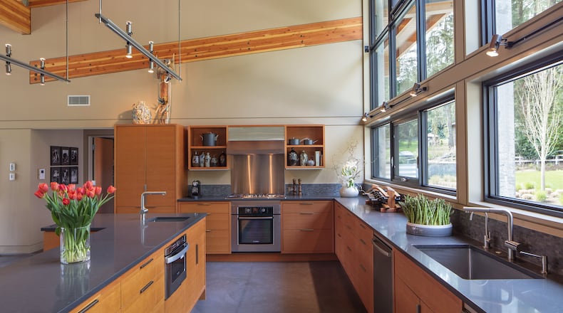 “Everything is on view” in the kitchen, with stone-look, stain-resistant Caesarstone countertops; a tile backsplash; and custom-crafted cabinetry from Douglas fir plywood, says architect Stephen Bobbitt. “We were mindful of what went where.” (Steve Ringman/Seattle Times/TNS)