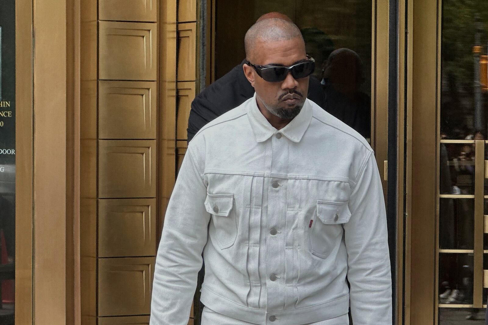 Ye, the rapper formerly known as Kanye West, leaves federal court during the trial of Sean "Diddy" Combs in New York, Friday, June 13, 2025. (AP Photo/Michael R. Sisak)