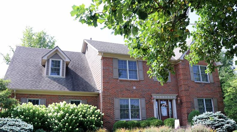 The 2-story, brick house has a finished basement with recreation room and wet bar. The upstairs main bedroom has an updated private bathroom, separate dressing area with closets and sitting room. CONTRIBUTED PHOTOS BY KATHY TYLER