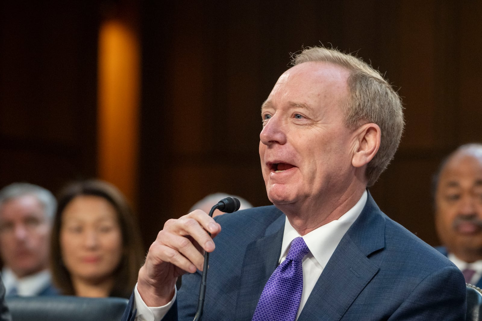 Brad Smith, vice chair and president, Microsoft Corporation, testifies before a Senate Committee on Commerce, Science, and Transportation hearing, Thursday, May 8, 2025, in Washington. (AP Photo/Kevin Wolf)