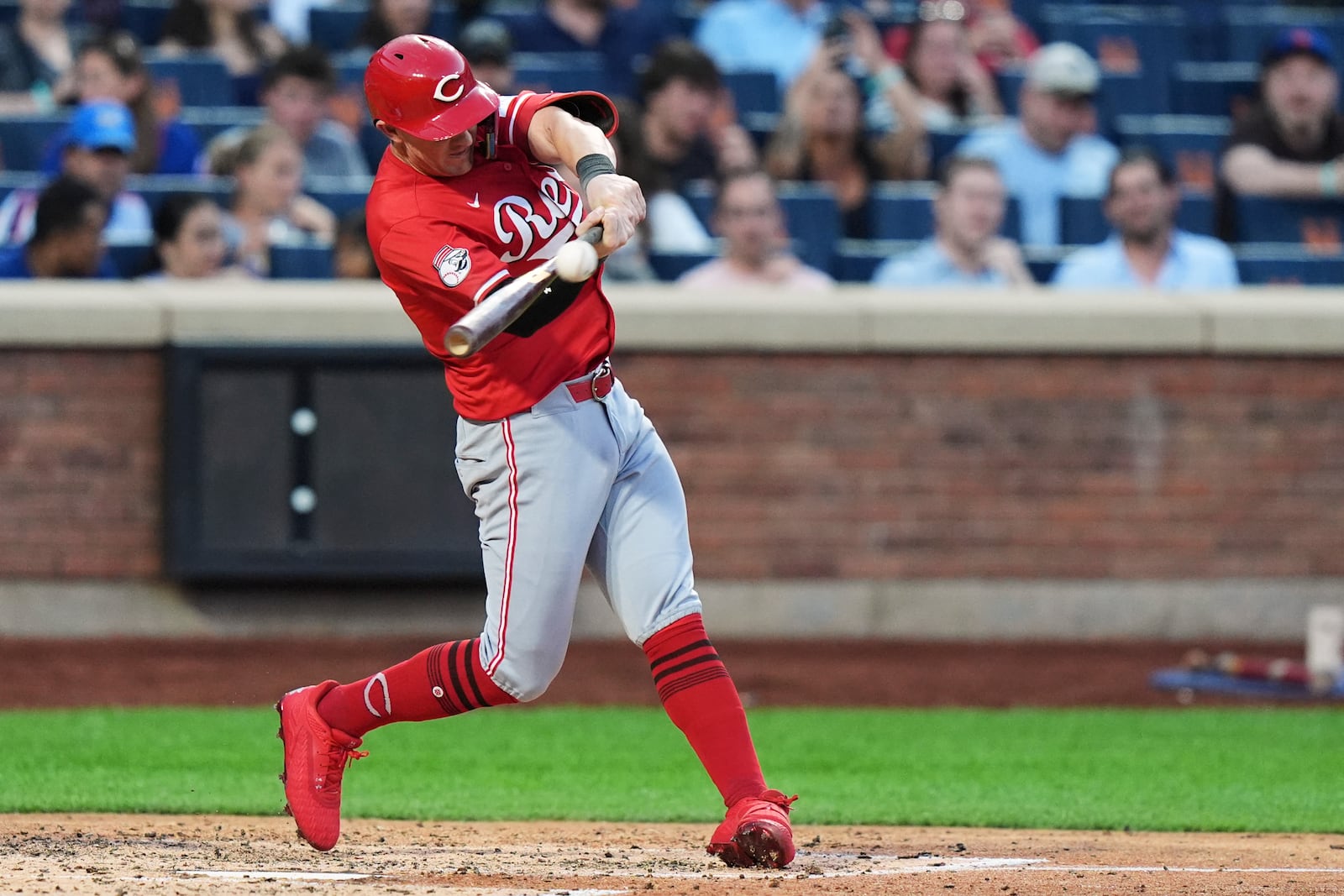 Cincinnati Reds' Austin Hays hits a home run during the fourth inning of a baseball game against the New York Mets Friday, July 18, 2025, in New York. (AP Photo/Frank Franklin II)