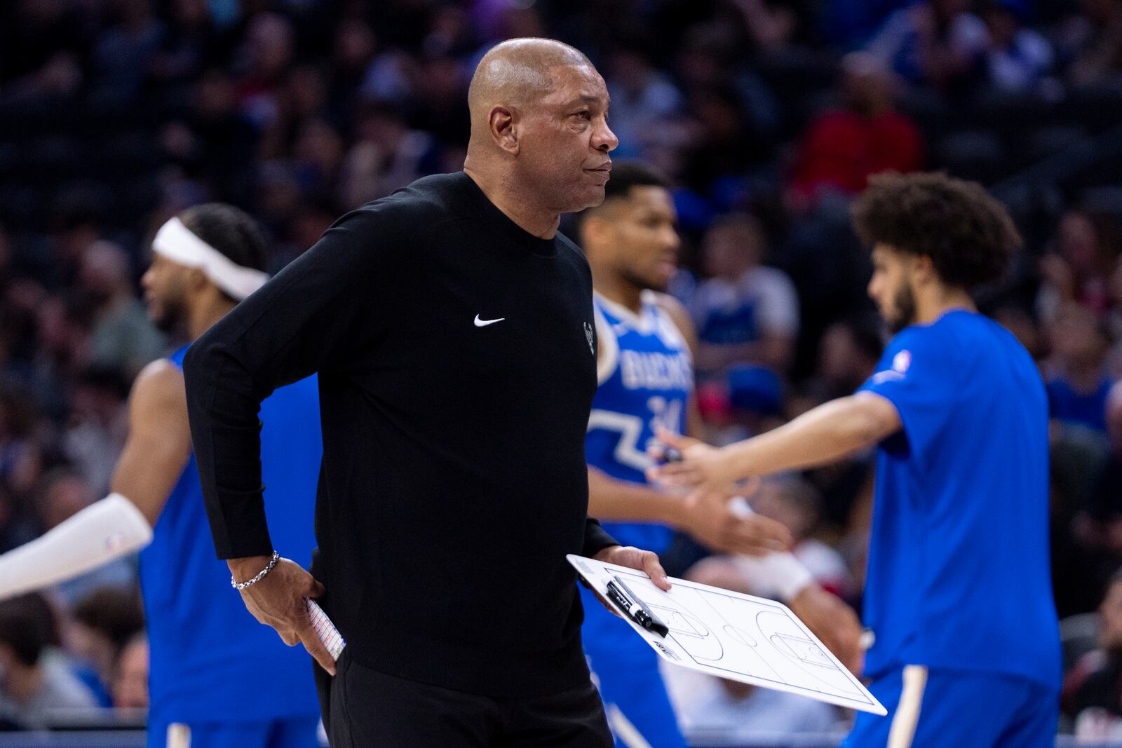 Milwaukee Bucks head coach Doc Rivers looks on during the first half of an NBA basketball game against the Philadelphia 76ers Thursday, April 3, 2025, in Philadelphia. (AP Photo/Chris Szagola)