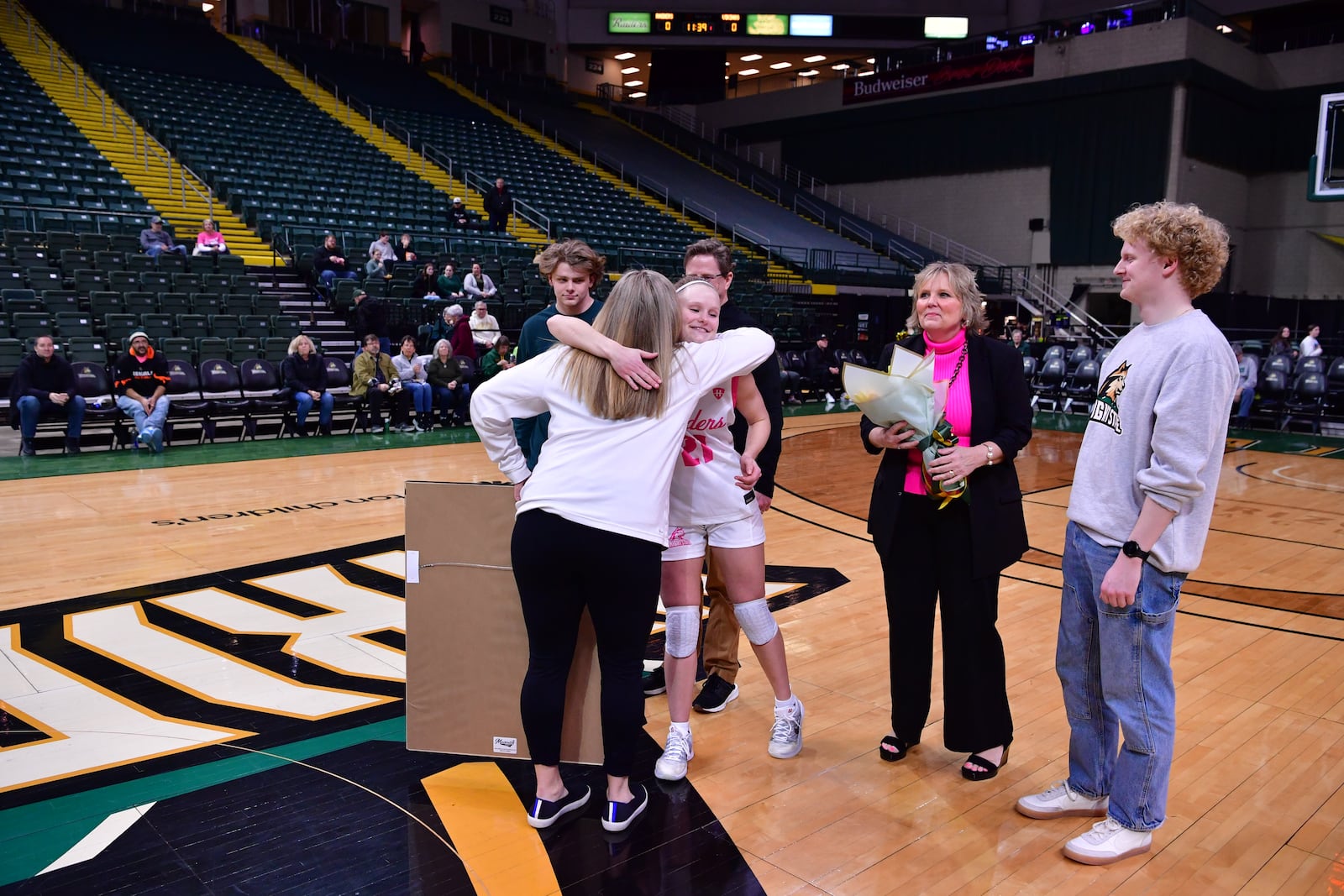 Wright State University's Lauren Scott hugs Raiders coach Kari Hoffman during their Senior Day ceremony on Wednesday, Feb. 25, 2026 at the Nutter Center. JOSEPH R. CRAVEN / CONTRIBUTED PHOTO