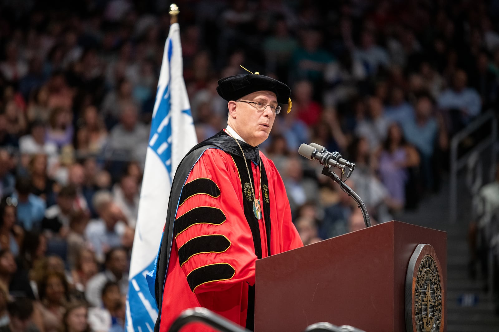 Eric Spina, president of the University of Dayton, speaks at UD's 2024 spring commencement on Sunday, May 5, 2024 at UD Arena. HAYDEN PARSONS\UNIVERSITY OF DAYTON