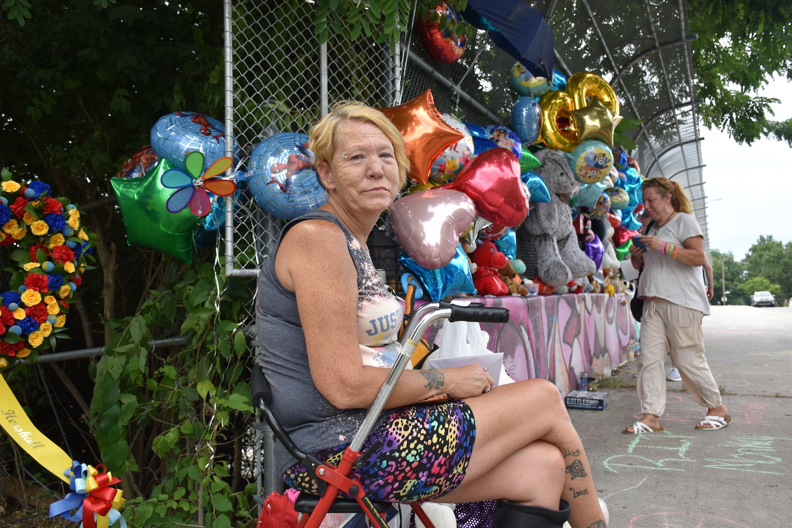 Missy Creachbaum, the grandmother of 7-year-old Hershall Creachbaum Jr., at a memorial for her grandson in East Dayton. CORNELIUS FROLIK / STAFF
