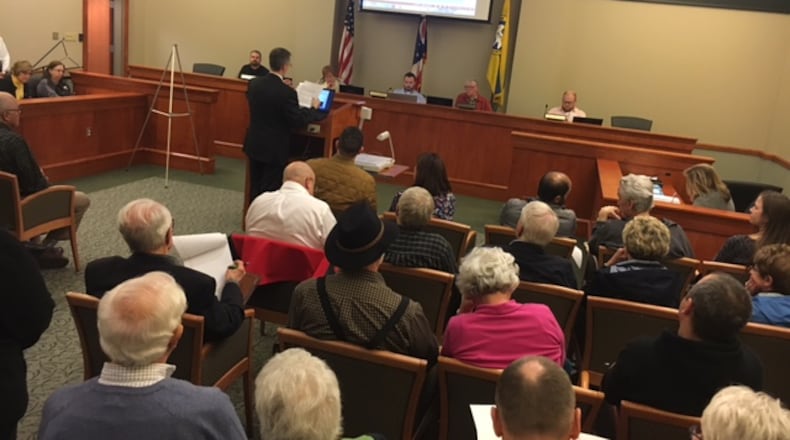 A proposal to build 88 homes on nearly 32 south of the Dayton Mall drew more than 70 people - many who question the plan - a Miami Twp. Zoning Commission meeting in March. NICK BLIZZARD/STAFF