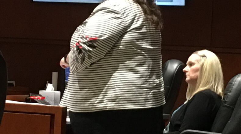 Former Springboro teacher Amy Panzeca listens as lawyer Andrea Ostrowski questions witnesses in court Wednesday, Aug. 8, 2018, in Lebanon. LAWRENCE BUDD/STAFF