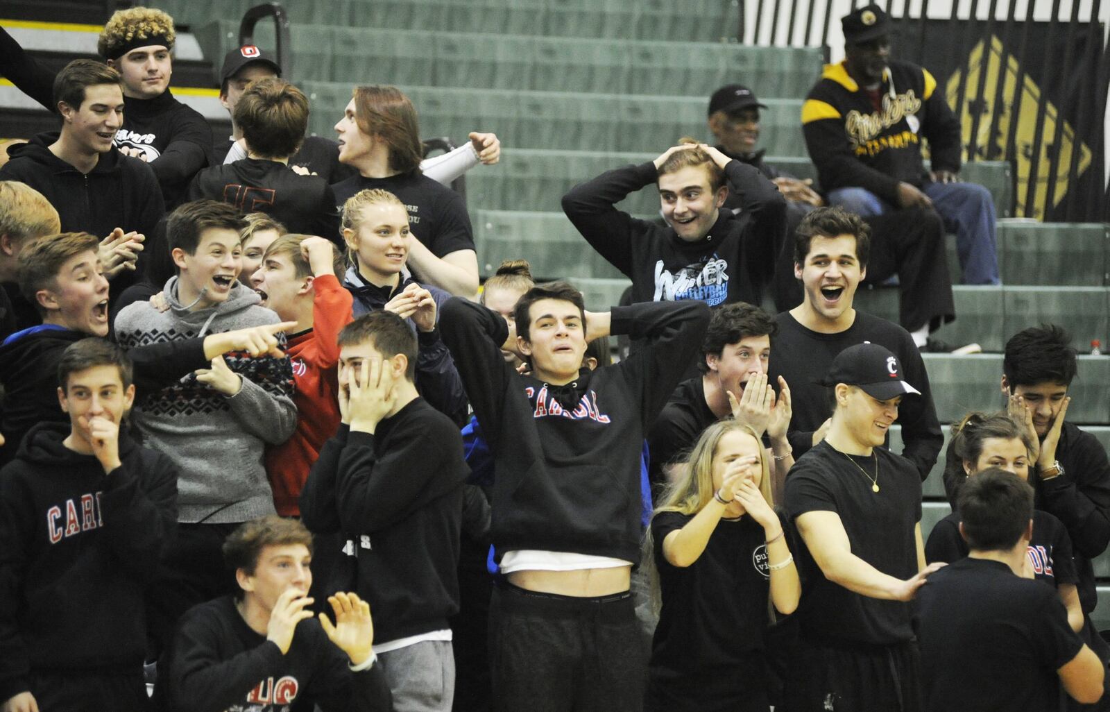 The Carroll student section is wowed after freshman Sarah Ochs reversed her dribble that sent a McNicholas defender to the floor. Carroll defeated Cincinnati McNicholas 47-37 in a D-II girls high school basketball district final at Mason on Friday, March 1, 2019. MARC PENDLETON / STAFF
