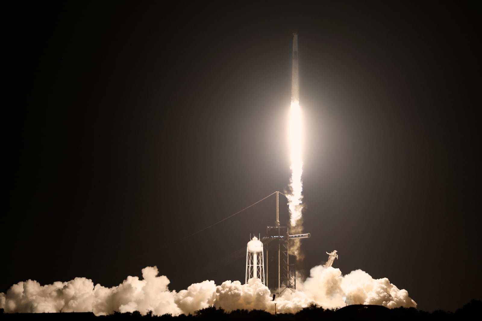 A SpaceX Falcon 9 rocket with a crew of four aboard a Dragon Spacecraft lifts off from pad 39A at the Kennedy Space Center in Cape Canaveral, Fla., Wednesday, June 25, 2025. (AP Photo/Terry Renna)