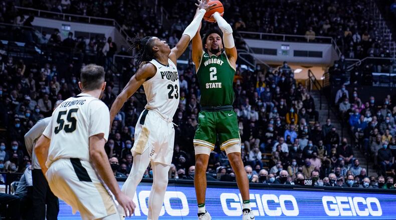 Wright State guard Tanner Holden (2) shoots over Purdue guard Jaden Ivey (23) during the first half of an NCAA college basketball game in West Lafayette, Ind., Tuesday, Nov. 16, 2021. (AP Photo/Michael Conroy)