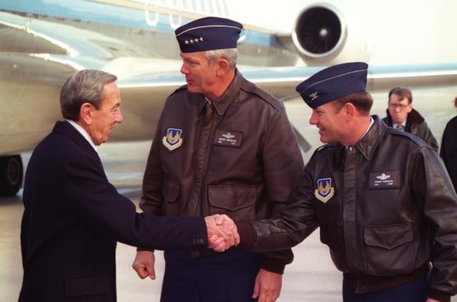 Col. Robbie Robinson, then-88th Air Base Wing commander, shakes then-Secretary of State Warren Christopher's hand as he and then-Air Force Materiel Command commander Gen. Henry Viccellio welcome members of the U.S. Department of State to Wright-Patterson Air Force Base for the Dayton Peace Accords. Air Force photo.