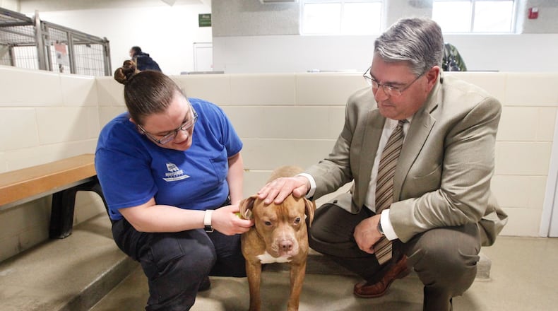 Robert Gruhl, director of the Montgomery County Animal Resource Center, was put in charge of overhauling the shelter in December after an independent review raised alarm about shelter operations. Gruhl is pictured at the ARC with Brittany Gibson, an animal care provider. CHRIS STEWART / STAFF