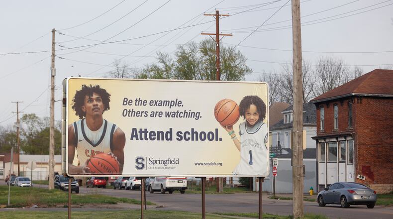 A billboard encouraging children to stay in school is displayed on the evening of Wednesday, April 23, 2025, at the intersection of West Main Street and Snyder Street. JOSEPH COOKE/STAFF