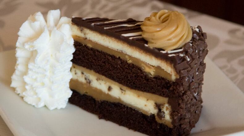 VIRGINIA BEACH, USA - JULY 29: The Cheesecake Factory's newest addition, Reese's Peanut Butter Chocolate Cake Cheesecake, is revealed on National Cheesecake Day at The Cheesecake Factory on July 29, 2010 in Virginia Beach, Virginia.  (Photo by Roberto Westbrook/Getty Images for The Cheesecake Factory)