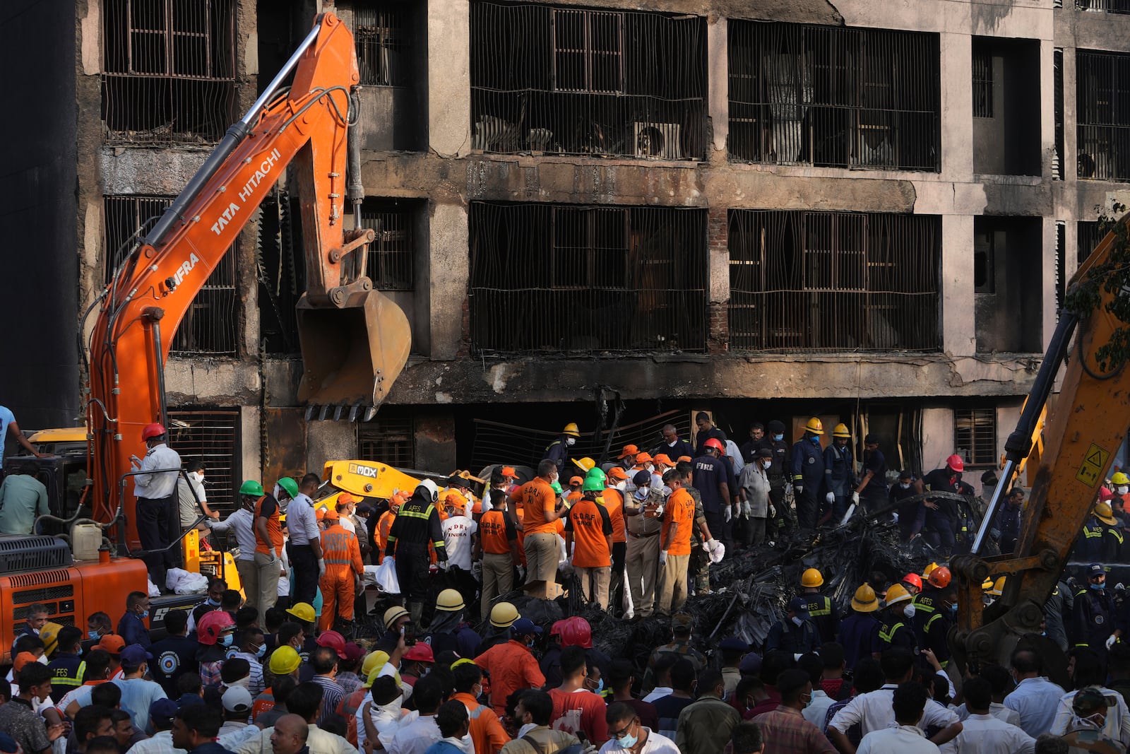 Search and rescue teams respond to the scene of a plane crash in Ahmedabad, India, Thursday, June 12, 2025. (AP Photo/Ajit Solanki)