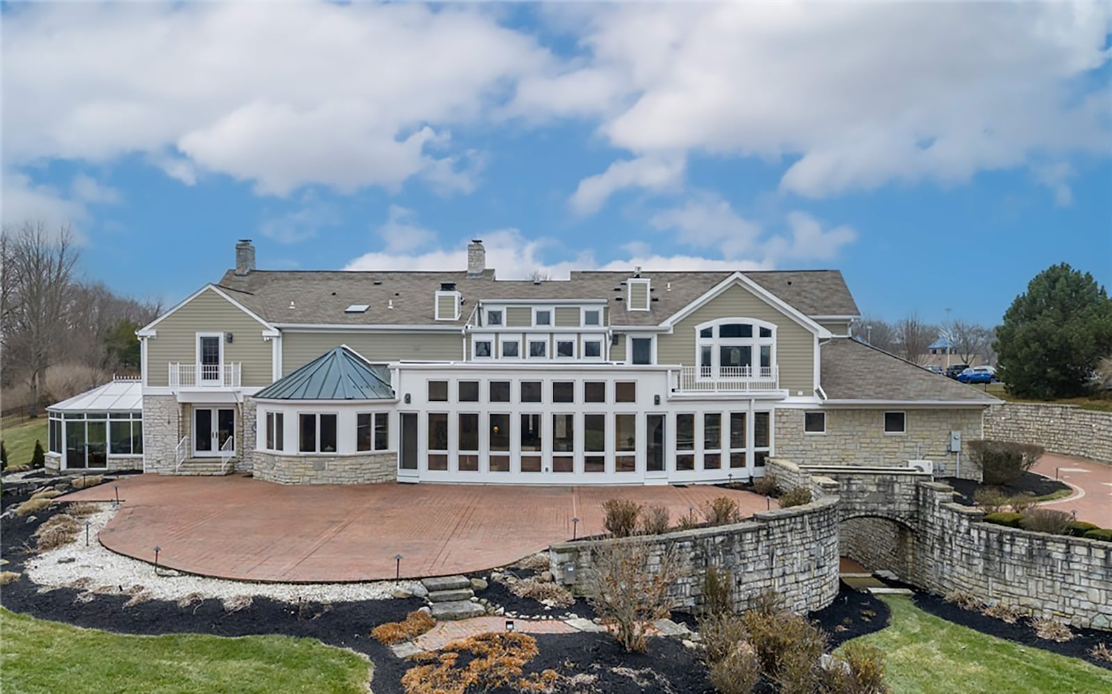 The back of the home has an oversized paver patio, a walk out basement with stone walls on either side, and extensive professional landscaping, including a water feature. CONTRIBUTED