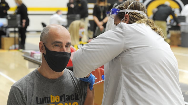 Oakwood schools Superintendent Kyle Ramey, receives his first dose of COVID-19 vaccine at Centerville High School, Wednesday, Feb. 3, 2021.