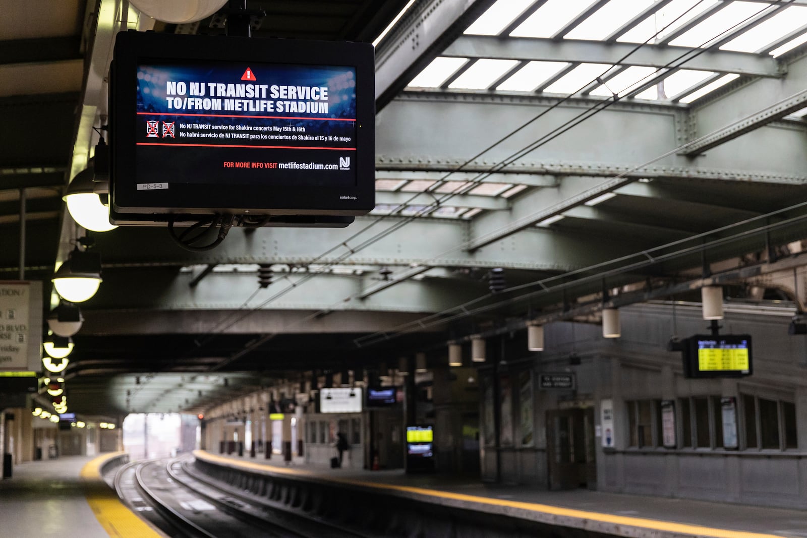 An empty PATH train platform with an information screen informing commuters of the rail service suspension, due to the strike by Union members from the Brotherhood of Locomotive Engineers and Trainmen, inside Newark Penn Station on Friday, May 16, 2025 in Newark, New Jersey. (AP Photo/Stefan Jeremiah)