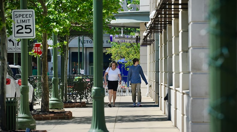 Shoppers at The Greene Town Center in Beavercreek in May. MARSHALL GORBY / STAFF