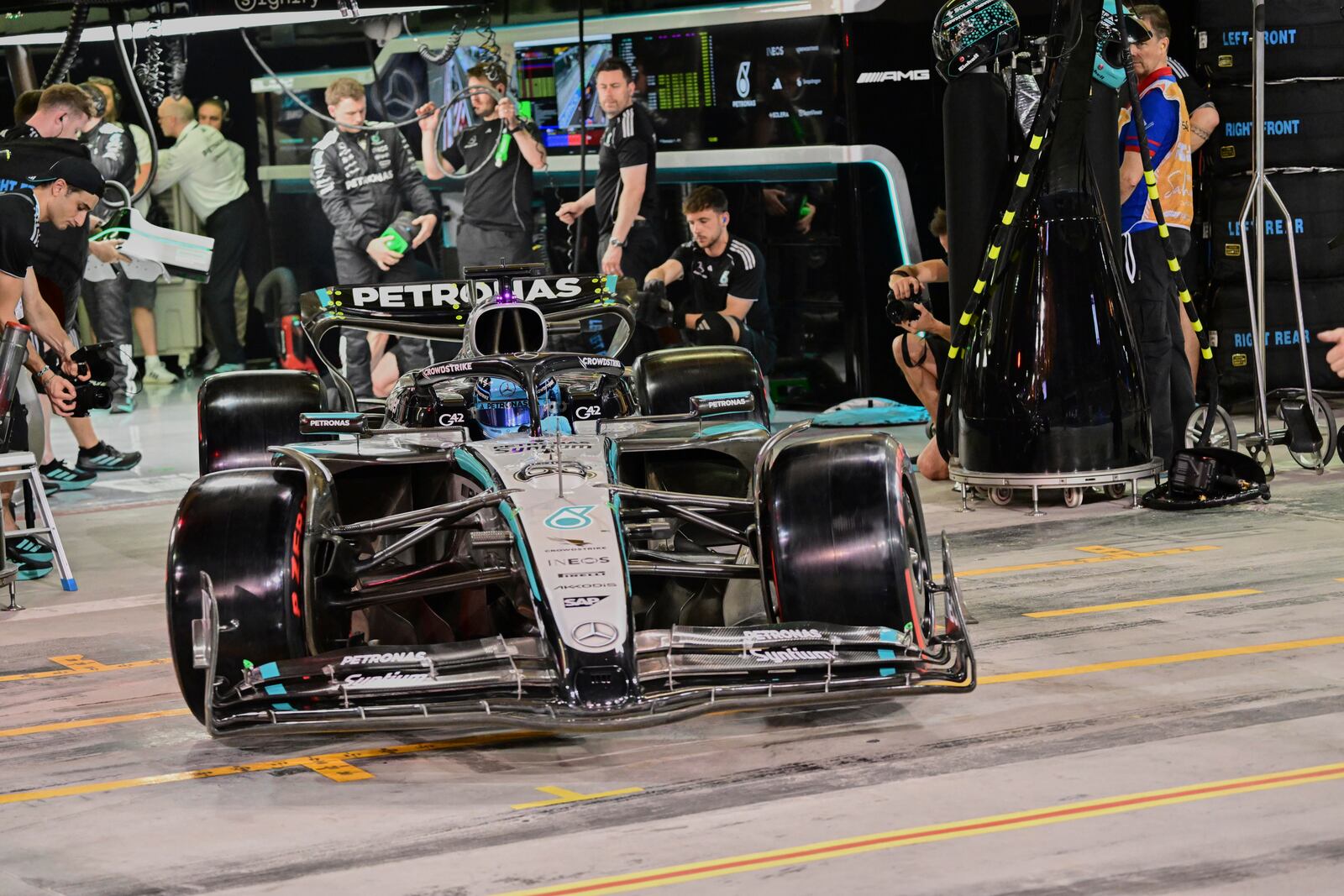 Mercedes driver George Russell of Britain leaves the pit during the Formula One qualifying at the Bahrain International Circuit in Sakhir, Bahrain, Saturday, April 12, 2025. (Giuseppe Cacace/Pool via AP)