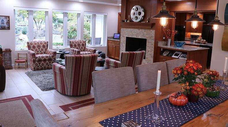 The family room features a fireplace with a raised hearth, built-in cabinets and bookshelves.