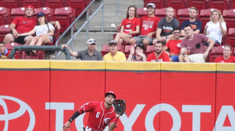 Reds center fielder Billy Hamilton makes a catch against the Marlins on Thursday, Aug. 18, 2016, at Great American Ball Park in Cincinnati. David Jablonski/Staff
