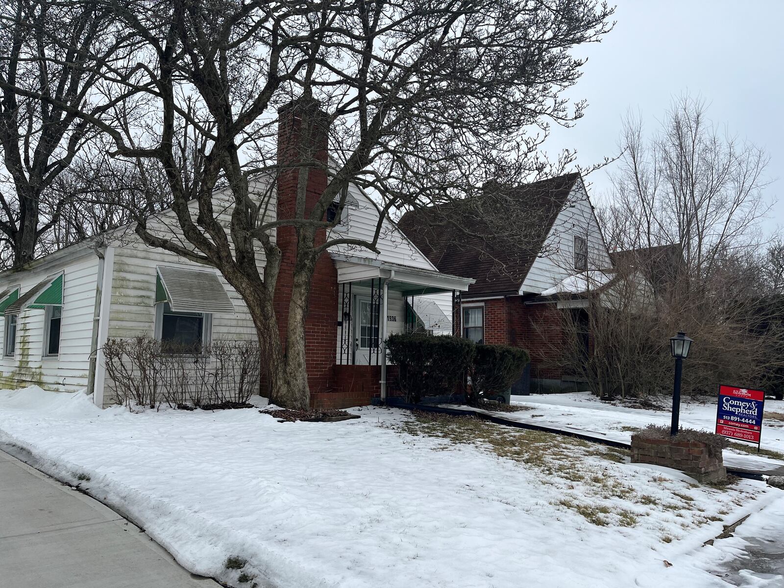 A home in northwest Dayton that recently was listed for sale online for $49,900. CORNELIUS FROLIK / STAFF