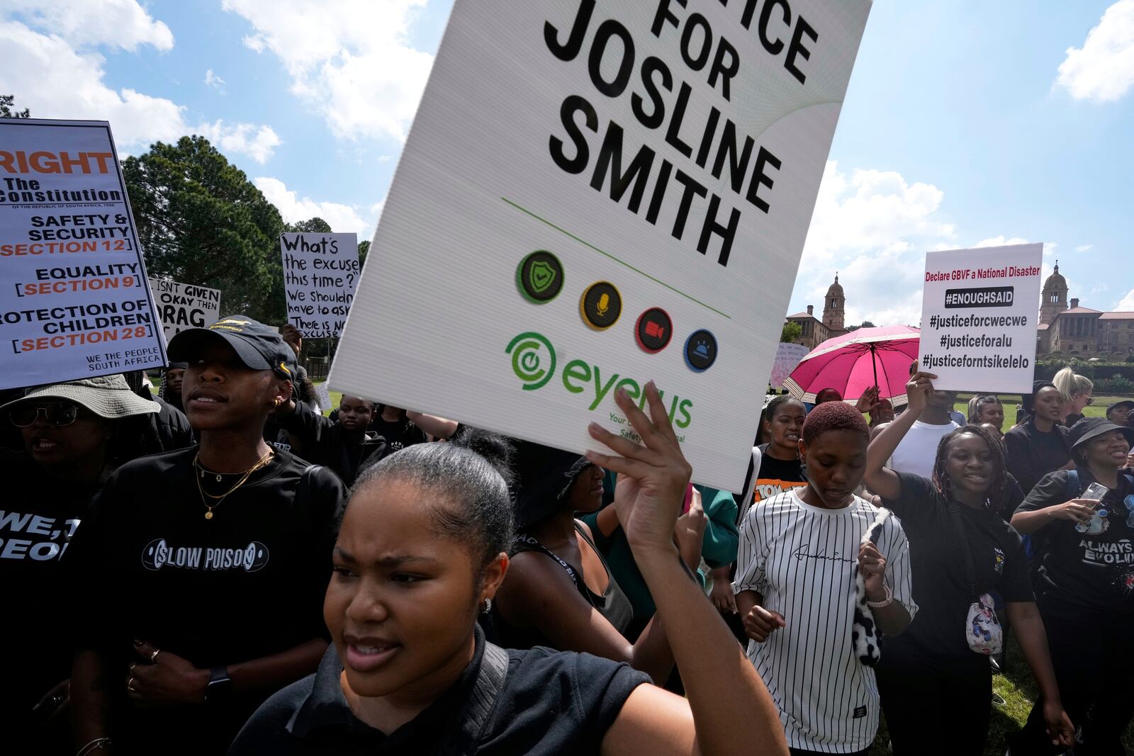 Activists chant slogans as they hold placards during the women's protest and hand over of a petition demanding that gender-based violence and femicide be declared a national disaster, at the Union Buildings in Pretoria, South Africa, Friday, April 11, 2025. (AP Photo/Themba Hadebe)