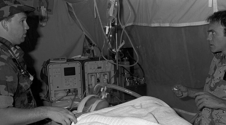 Medical personnel prepare Corporal Richard Ramirez, a member of the 1st Marine Division, for medical evacuation by a C-141B Starlifter aircraft from Al-Jubail Airport to Germany for treatment of chest wounds sustained during Operation Desert Storm. During this time, Aeromedical Evacuation teams were prepared and were able to transport up to 3,600 casualties a day. U.S. AIR FORCE PHOTO/AIR FORCE SURGEON GENERAL PUBLIC AFFAIRS