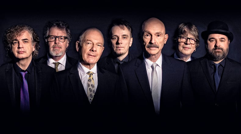 The three-drummer lineup of the ever-evolving progressive rock act King Crimson, (left to right) Jakko Jakszyk, Pat Mastelotto, Robert Fripp, Gavin Harrison, Tony Levin, Mel Collins and Jeremy Stacey, performs at Rose Music Center in Huber Heights on Thursday, Sept. 2. CONTRIBUTED
