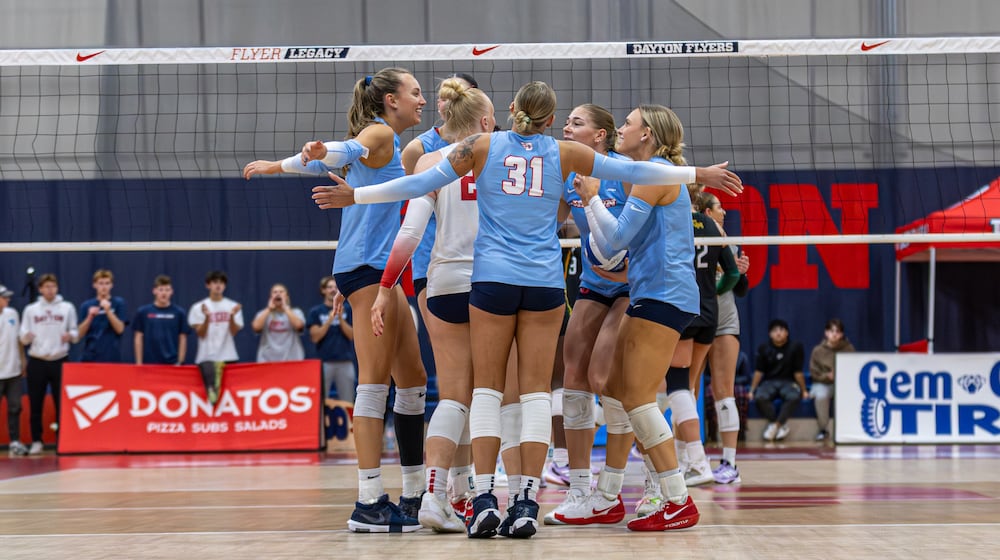 The Dayton volleyball team huddles during a match in the 2025 season. Photo courtesy of University of. Dayton.