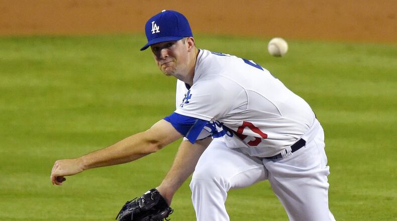 Los Angeles Dodgers starting pitcher Alex Wood throws to the plate during the second inning of a baseball game against the San Diego Padres, Friday, Oct. 2, 2015, in Los Angeles. (AP Photo/Mark J. Terrill)