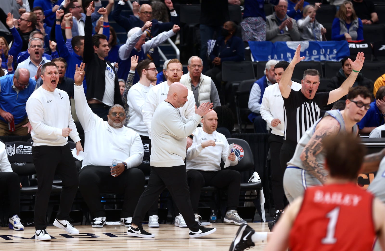 Saint Louis coach Josh Schertz, center, reacts after a 3-pointer by Gibson Jimerson in the final minutes of a game against Davidson in the second round of the Atlantic 10 Conference tournament on Thursday, March 13, 2025, at Capital One Arena in Washington, D.C. David Jablonski/Staff