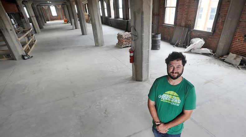 Jeff Graley, founder and CEO of the Dayton software firm Mile Two, in a photo shot earlier this year at his company's new location at the Manhattan on Third Street. MARSHALL GORBY\STAFF
