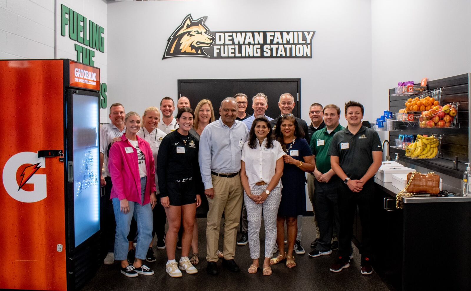 Sudan Dewan (center), a top 20 player in NCAA Division II when he played at Wright State,  with his wife  Rachna (white shirt)  and his sister Renu (dark shirt). They are surrounded by some of Wright State's athletics staff, including athletic director Bob Grant, men's basketball coach Scott Nagy, women’s basketball coach Kari Hoffman and strength and conditioning coach Cole Pittsford. Wright State Athletics photo