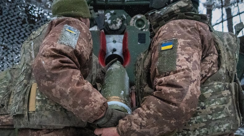 FILE - Ukrainian servicemen load an artillery shell before firing at Russian positions on the front line in Kharkiv region of Ukraine, Wednesday, Feb. 18, 2026. (AP Photo/Andrii Marienko, File)