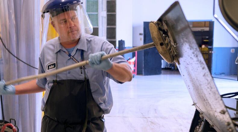 David McBeth, 88th Logistic Readiness Squadron Aerospace Ground Equipment worker, cleans a light cart in the AGE shop on Wright-Patterson Air Force Base Aug. 18. The 88th LRS is responsible for all the ground equipment used to support visiting aircraft. (U.S. Air Force photos/R.J. Oriez)