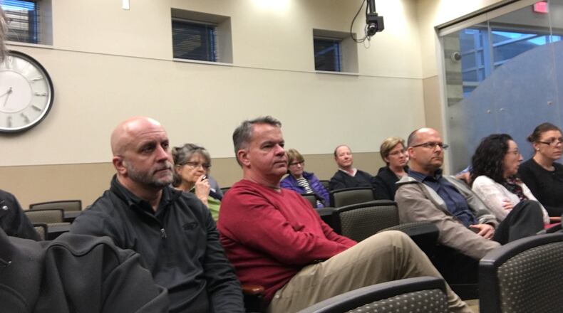 Residents wait to speak during a meeting on plans to develop the historic Easton Farm in Springboro.