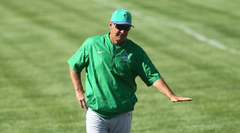 Chaminade Julienne’s Mike Barhorst talks to a hitter during a game against Cincinnati Hills Christian Academy in a Division II regional final on Friday, May 25, 2018, at Mason High School. David Jablonski/Staff