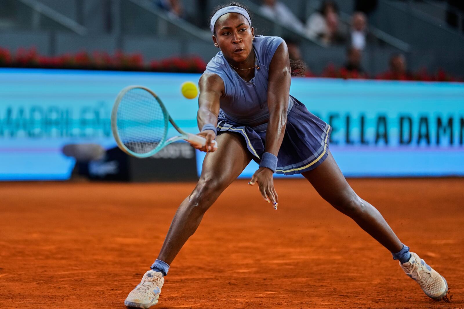 United States' Coco Gauff returns the ball against Ukraine's Dayana Yastremska during the Madrid Open tennis tournament in Madrid, Spain, Thursday, April 24, 2025. (AP Photo/Manu Fernandez)