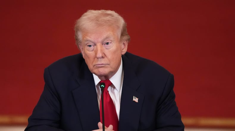 President Donald Trump listens during a roundtable discussion on college sports in the East Room of the White House, Friday, March 6, 2026, in Washington. (AP Photo/Julia Demaree Nikhinson)