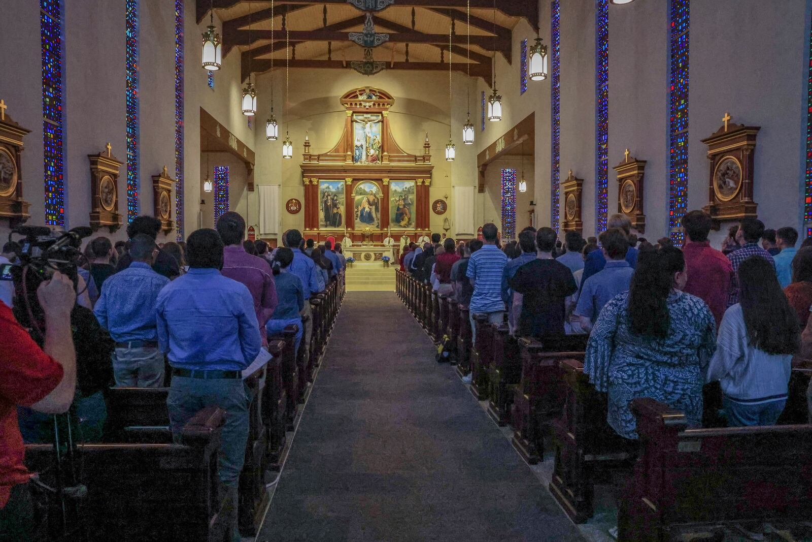 A service is held at Co-Cathedral of St. Thomas More, a Catholic cathedral, across from the Woodward Avenue entrance to Florida State University campus, following a shooting, Thursday, April 17, 2025, in Tallahassee, Fla. (AP Photo/Gary McCullough)