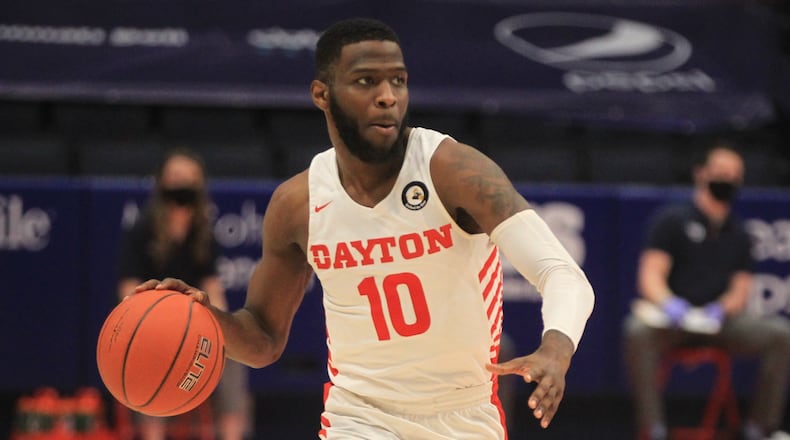 Dayton's Jalen Crutcher dribbles against Saint Louis on Friday, Feb. 19, 2021, at UD Arena. David Jablonski/Staff