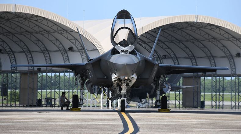 An F-35A Lightning II pilot prepares for a flight at Eglin Air Force Base, Fla., July 30. The F-35A is designed to achieve unprecedented levels of reliability and maintainability, combined with a highly responsive support and training system linked with the latest in information technology. (U.S. Air Force photo/Airman 1st Class Heather Leveille)