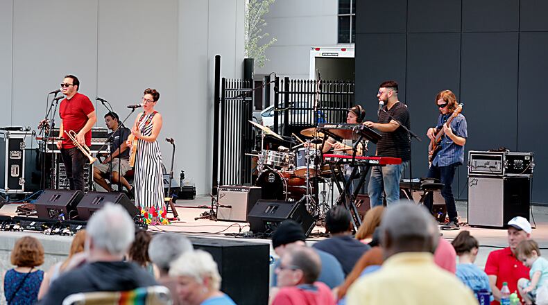 Texas-based singer Gina Chavez performs at the Levitt Pavilion in a dress she bought from Clash in Dayton.